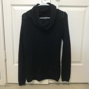A lady’s black sweater size S